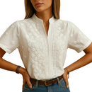 Women's white blouse featuring a classic button-front design