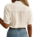 Close-up of classic collar on women's white blouse